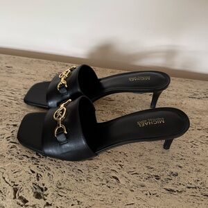 MICHAEL Michael Kors Black Heeled Mules with Gold Accents. Size 7. MSRP $149